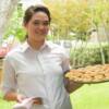 Lindsey Chabot serving fried green tomatoes topped with a sundried tomato aioli.